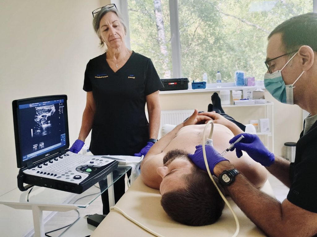 Dr. Lynch performing an ultrasound-guided SGB at Lisova Polyana near Kyiv